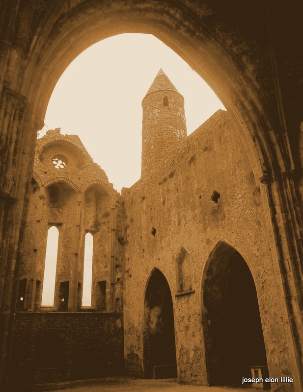 A steeple tower framed in the ruins of the Rock of Cashel